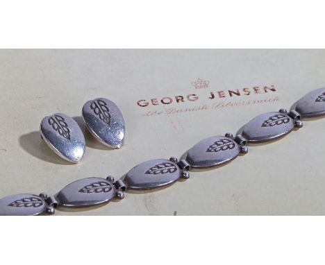 A sterling silver Georg Jensen necklace with leaf stamps and matching stud earrings.Necklace stamped Stirling Danish 94a. Len