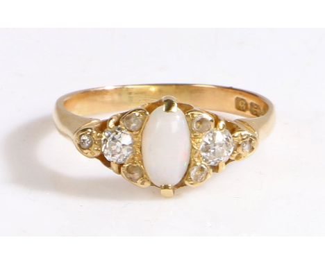 An 18ct yellow gold ring with an opal and diamonds.
Approx. oval measurements: 7.4 x 3.7mm.
Approx. total diamond carat weigh