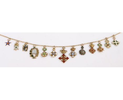 A 9ct yellow gold curb chain with white and yellow metal, with enamel, religious medallions; including Order of the cross of 