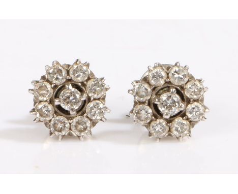 A pair of white Indian metal diamond cluster earrings.Approx. total diamond carat weight: 2.00cts. Colour: I-K. Clarity: SI1-
