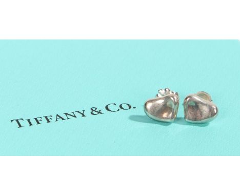 A pair of sterling silver Tiffany & Co. heart stud earrings. With original box.Diameter 9mm.Weighing 3 grams.Used, in very go