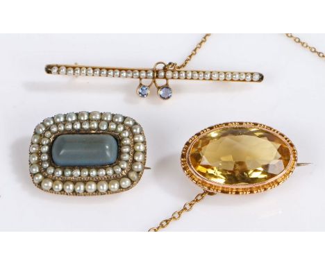 A 9ct gold citrine set brooch - 22mm length. A yellow metal pearl and blue cabochon set brooch - 45mm length.A yellow metal 1