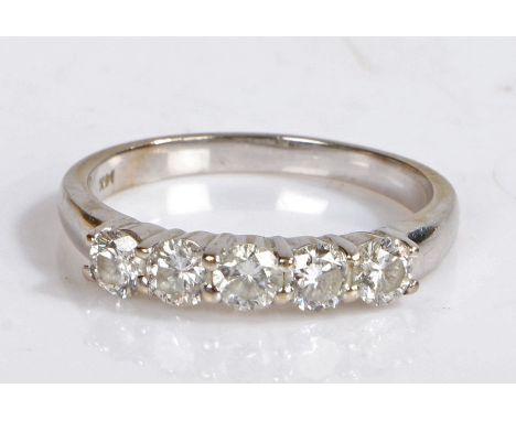 A 14ct white gold ring set with five diamonds.Approx. total diamond carat weight: 0.85cts. Colour: I-J. Clarity: I1.Ring size