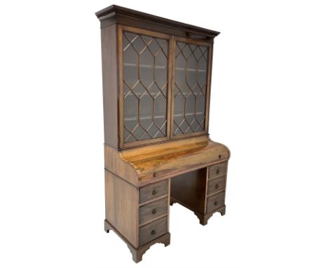 Early to mid-20th century rosewood and mahogany piano top secretaire bookcase, the projecting dentil cornice over two astraga