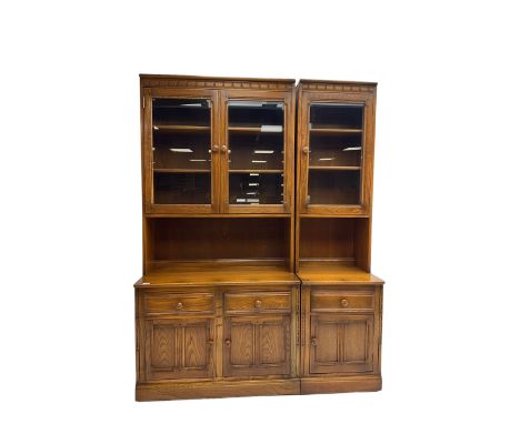 Ercol - medium elm wall display cabinet, fitted with three glaszed cupboards, three drawers and three panelled cupboardsDimen