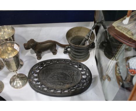 Victorian cast iron dog nutcracker, an Amor Vincit pestle and mortar and Coalbrookdale commemorative Ironbridge trivet