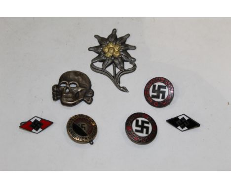 Bag of badges comprising floral metal badge, skull badge and 4 German Nazi badges, marked RZ or Ges Gesch to the back