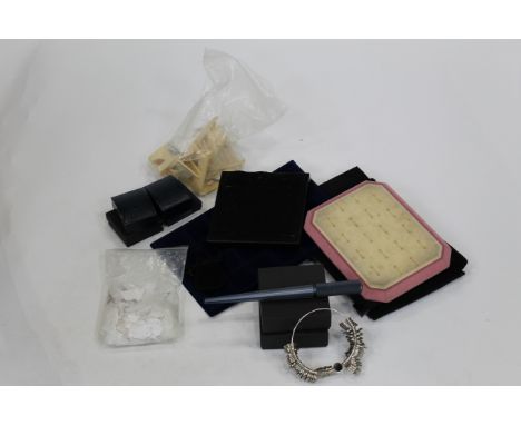 Box of ring holders, ring sizers and other accessories