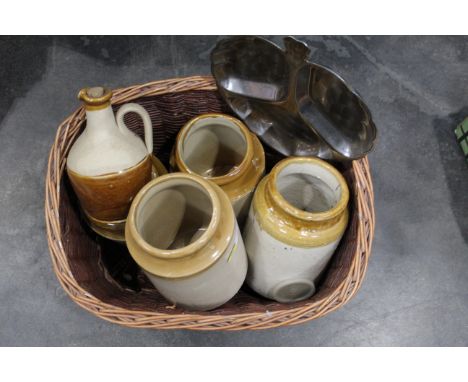 Basket of stainless steel nut dish, four stoneware storage jars, jugs with stoppers, brass bell, glass decanter and glass lid