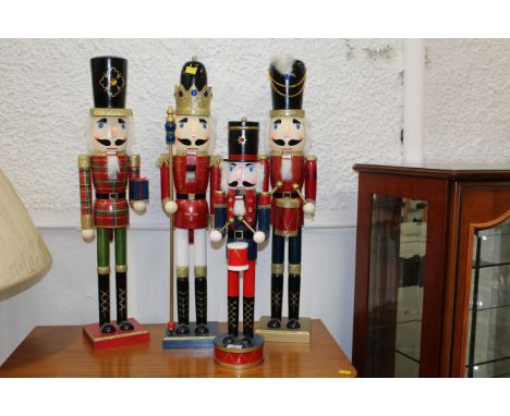 Four festive soldier Nutcracker figures, tallest 75 cm