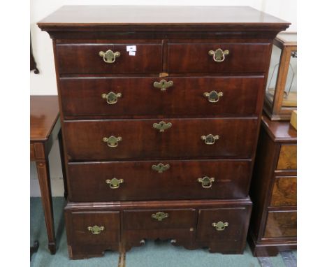 A Georgian mahogany chest with two drawers over three full width drawers over three small drawers on bracket feet with brass 