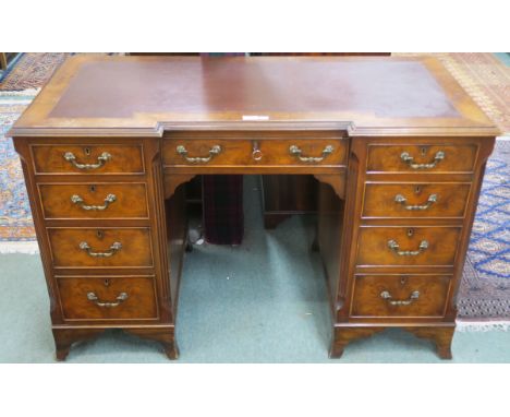 A mahogany twin pedestal desk with rexine skiver on bracket feet, 77cm high x 122cm wide x 61cm deep Condition Report: Availa