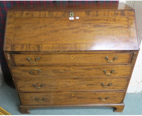 A Georgian mahogany inlaid bureau with fitted interior, four graduating drawers on bracket feet, 108cm high x 112cm wide x 57