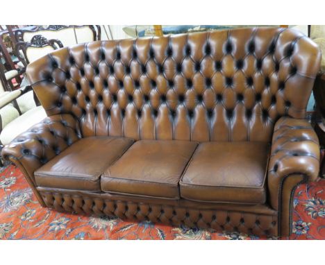 A dark tan leather button back sofa, 92cm high x 190cm wide 87cm deep Condition Report: Available upon request