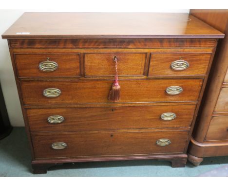 A 19th Century mahogany inlaid three over three chest of drawers on bracket feet, 106cm high x 118cm wide x 54cm deep Conditi