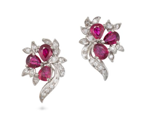 A PAIR OF RUBY AND DIAMOND EARRINGS in 14ct white gold, each set with three pear cut rubies and single cut diamonds in a foli