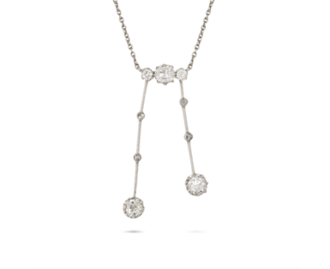 AN ANTIQUE DIAMOND NEGLIGEE NECKLACE in platinum, the pendant set with three old cut diamonds suspending two drops set with r