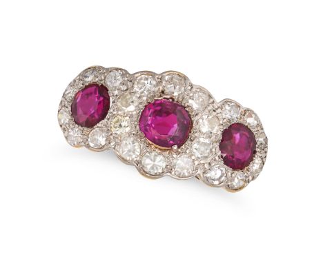 A RUBY AND DIAMOND CLUSTER RING in 18ct yellow gold and platinum, set with three round cut rubies in a cluster of single and 