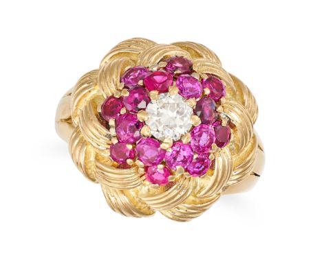 A RUBY AND DIAMOND BOMBE RING in 18ct yellow gold, set with a transitional cut diamond of approximately 0.47 carats in a clus