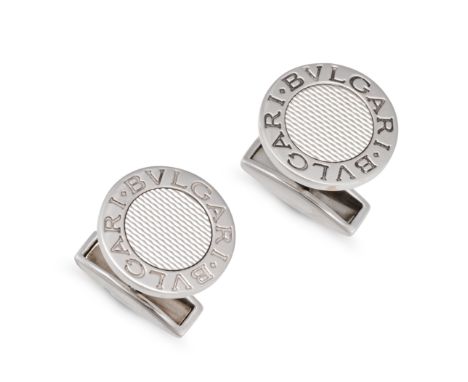 BULGARI, A PAIR OF CUFFLINKS in 18ct white gold, each comprising an engine turned disc in a border engraved with BVLGARI, swi