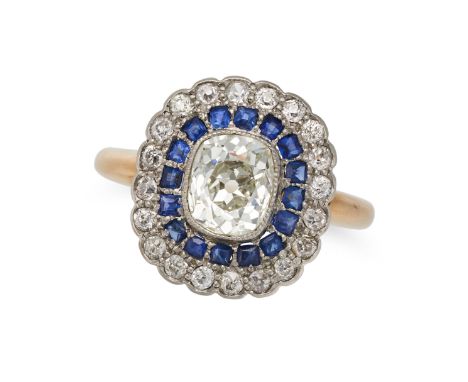AN ANTIQUE DIAMOND AND SAPPHIRE CLUSTER RING in 18ct yellow gold, set with an old cut diamond of approximately 1.36 carats, i