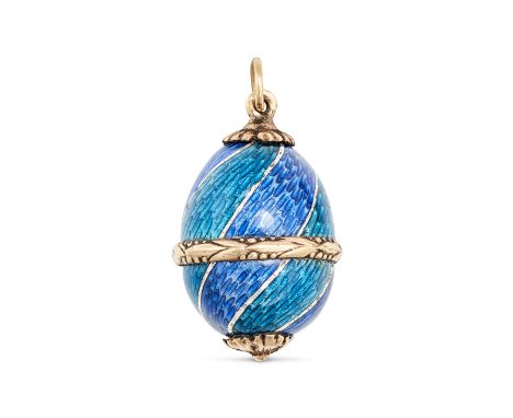 AN ANTIQUE RUSSIAN ENAMEL EGG PENDANT in 14ct yellow gold, the pendant designed as an egg decorated with two shades of blue g