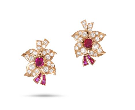 A PAIR OF RUBY AND DIAMOND FLOWER EARRINGS in yellow gold, each designed as a flower and set to the centre with a cushion cut