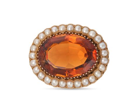 AN ANTIQUE CITRINE AND PEARL BROOCH in yellow gold, set with an oval cut citrine of approximately 30.50 carats, in a border o