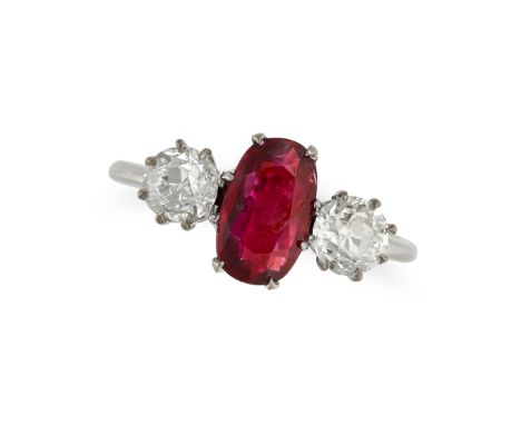 A RUBY AND DIAMOND THREE STONE RING in 18ct white gold, set with an oval cut ruby of approximately 1.63 carats between two ol