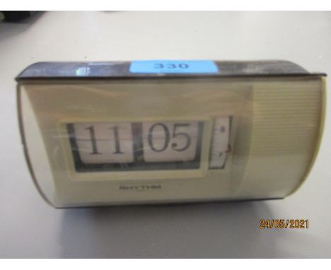A vintage Rhythm flip alarm clock model no. 16505 Location: 5.1 