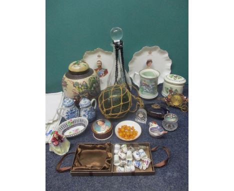 A vintage enamelled bedside clock, loose amber beads and a jet necklace, mixed thimbles and 20th century ceramics and glass t