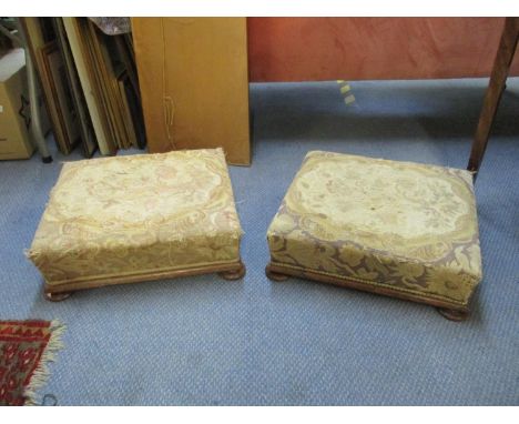 A pair of Victorian rosewood foot stools with tapestry upholstery 14 h x 45 w x 40cm d 