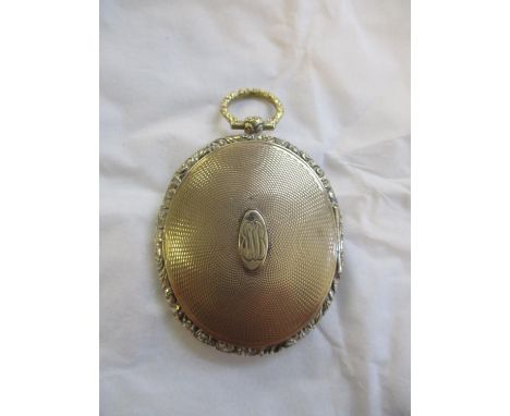 A 9ct and yellow metal locket with engine turned design, front and back panel unmarked but tests as gold, A/F, 9.4gLocation: 