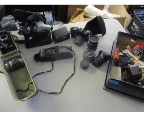 Vintage cameras to include Polaroid Button, a Yashica T3, a Kodak Instamatic 25, an Asahi Pentax Spotmatic, various lenses an