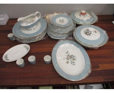A Royal Doulton Rose Elegans dinner service to include dinner plates, side plates, tureens and other items 