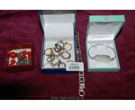 A Silver Bangle with shell inlay, various silver and amber pieces, various rings, etc.