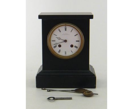 A Frodsham Victorian black slate clock with white enamel dial, Marked “Chas. Frodsham, Clock maker to the Queen.”, gong strik