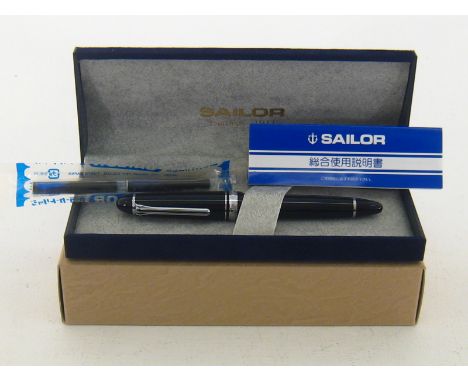 Sailor. A Sailor 1911 Silver fountain pen. Black resin body. 21K gold nib. Cartridge / converter filling system. Includes ori