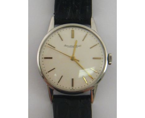 IWC. A gent's International Watch Company Automatic stainless steel wrist watch. White dial with gilt indexes. Round case dia
