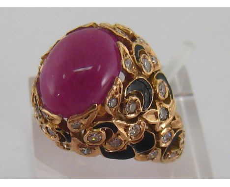 A 1980s ruby, diamond and enamel dress ring, the cabochon ruby 11.2mm long above a chased openwork mount set overall with eig