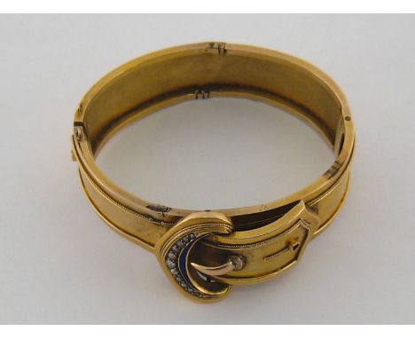 A Victorian 15 carat yellow gold, seed pearl and enamel bangle, designed as a belt and buckle, 25.2gms
 CONDITION REPORT: : t