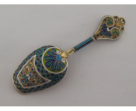 A Russian silver-gilt and cloisonné enamel shovel bowl caddy spoon by Antip Kuzmichev, “88” standard, Moscow, 1899/1908, tref