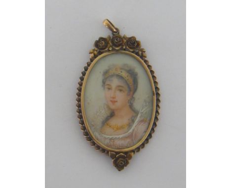 A portrait miniature pendant, depicting a lady in three quarter profile, 37mm long, within a gilt metal frame
