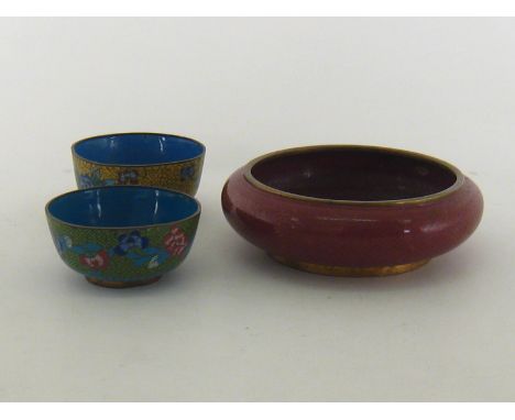 A red lacquer bowl fishscale cloisonné decorated inside and out, probably 19th. century. 20cm. diameter, together with two mo