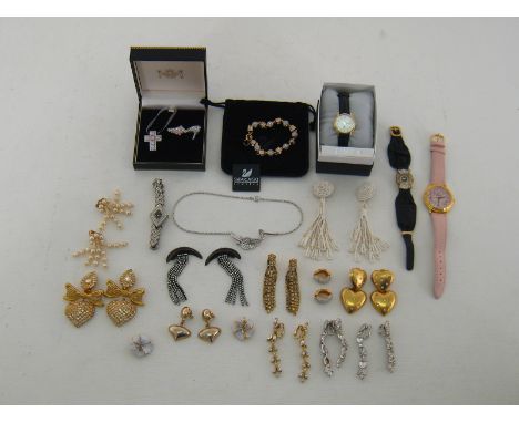A collection of costume jewellery and watches, including a Swarovski bangle, paste set ear clips, a Christening brooch and pe