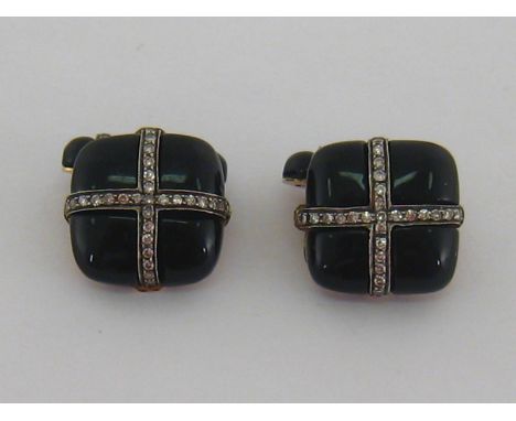 A pair of French jet and diamond cuff links, the cushion shaped links set with a cross of small single cuts, with bars en sui
