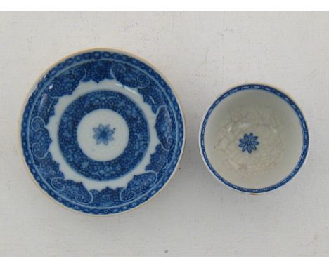 A 19th century Chinese blue and white export ware saucer, the underglaze blue with finely painted fish roe diaper double bord