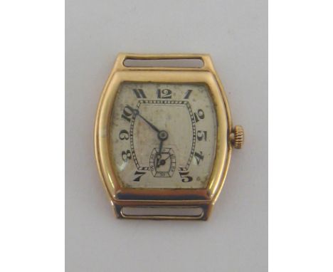 An Art Deco 9 carat gold manual wind watch (head only), the tonneau shaped case with silvered dial, black Breguet numerals, a