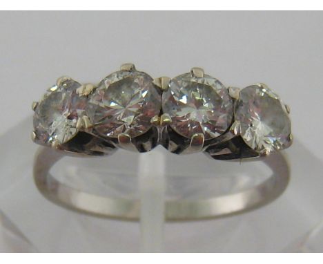 A diamond four stone ring, the four brilliants totalling approx. 1.67 carat, claw set in a white metal (tests as 18 carat gol