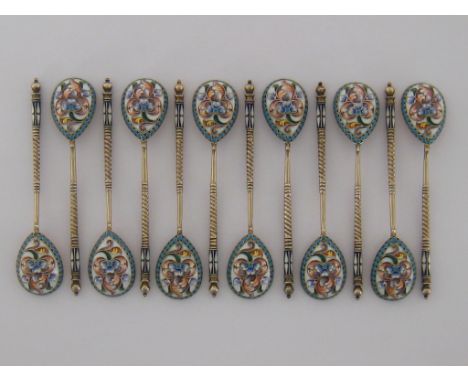 A set of 12 Russian silver-gilt and shaded cloisonné enamel teaspoons by Nikolay Alexeyev, Moscow, 1899/1908, bowls painted w